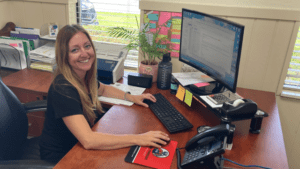 Kelly Rechlicz at desk